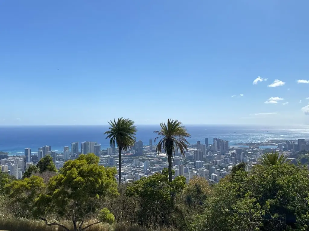 Top of the Nutridge Estate looking down at a scenic view overlooking Oʻahu, Hawaiʻi coastline and city landscape featured in The Ultimate Oʻahu Travel Guide.