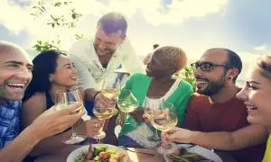 Aerial view of Waikiki Beach at sunset with festival lights and food tents during the Hawai‘i Food & Wine Festival, O‘ahu, Hawai‘i.